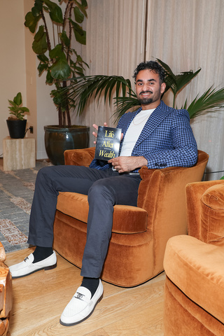 Sachin Sharma holding Life After Wealth